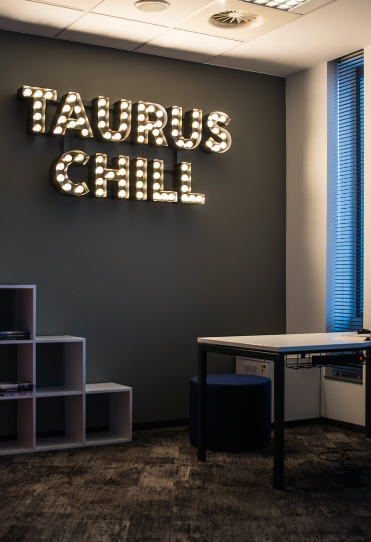 Taurus Chill - letters with light bulbs placed on the wall